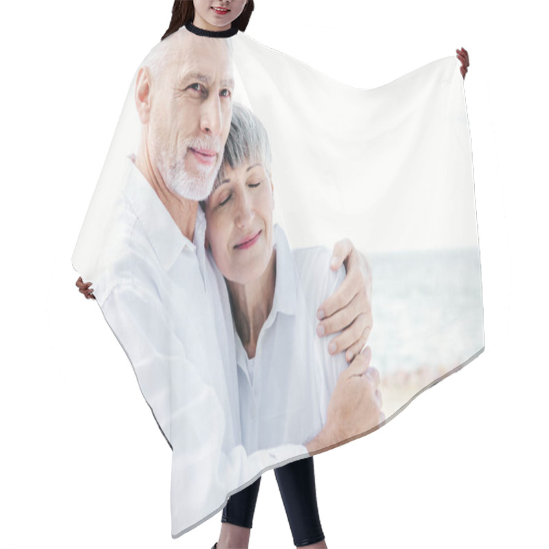 Personality  Happy Senior Couple In White Shirts Embracing At Beach Hair Cutting Cape