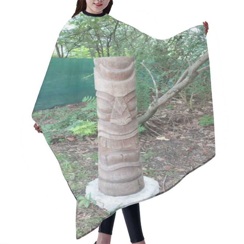 Personality  Carved Wooden Totem Pole Amidst Lush Greenery In A Forest Setting. Hair Cutting Cape