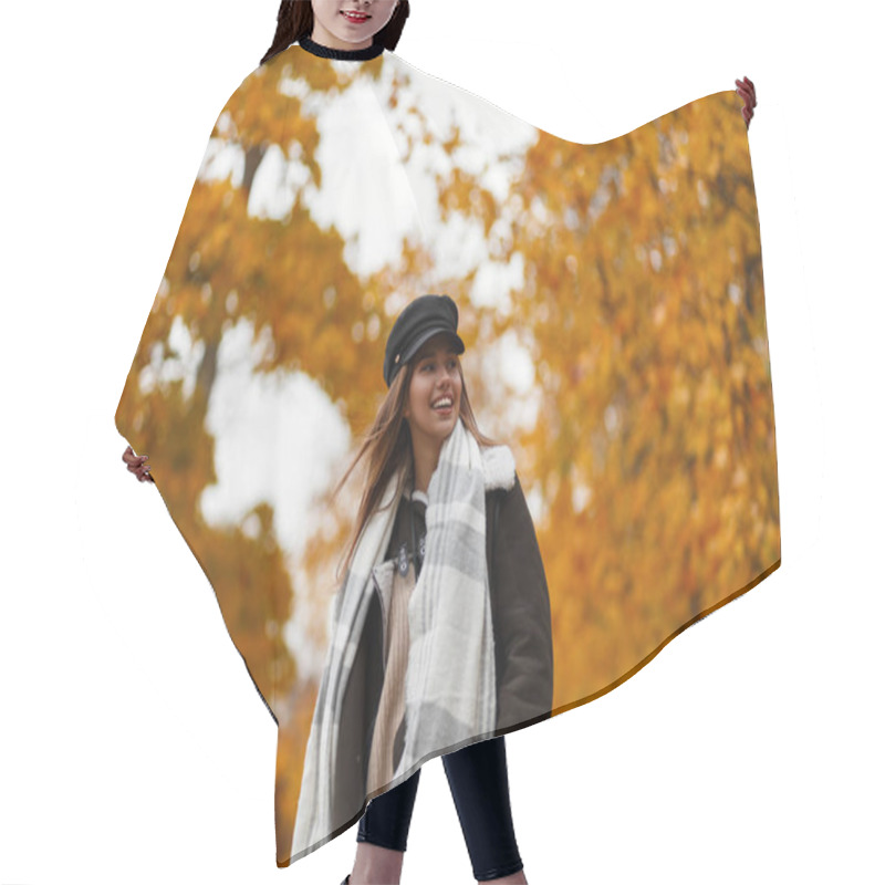 Personality  Elegant Happy Young Woman In A Chic Hat In A Stylish Brown Jacket With A Scarf With A Cute Smile Posing On The Background Of Trees With Gold Leaves In The Park On A Autumn Day. Funny Girl Outdoors. Hair Cutting Cape