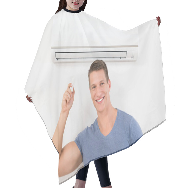 Personality  Portrait Of Happy Man Using Remote Control To Operate Air Conditioner Hair Cutting Cape