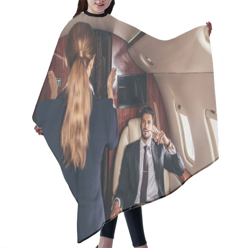 Personality  Handsome Businessman In Suit Looking At Flight Attendant In Private Plane  Hair Cutting Cape