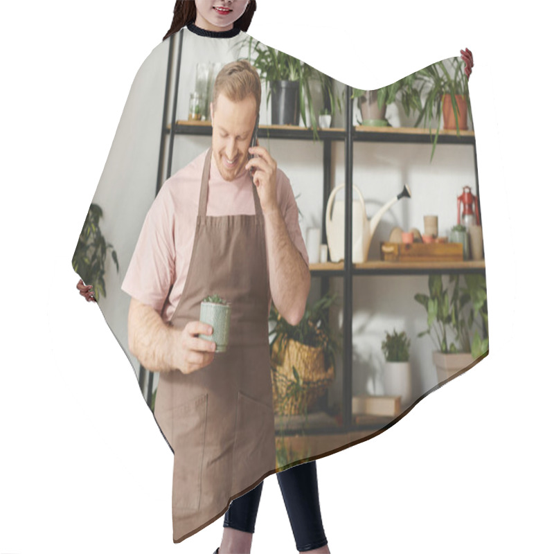 Personality  A Charming Man, Owner Of A Plant Shop, Standing In His Apron And Holding Plant Pot Hair Cutting Cape