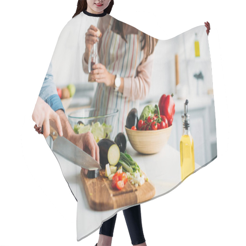 Personality  Cropped Image Of Boyfriend Cutting Ingredients And Girlfriend Adding Spices To Salad In Kitchen Hair Cutting Cape