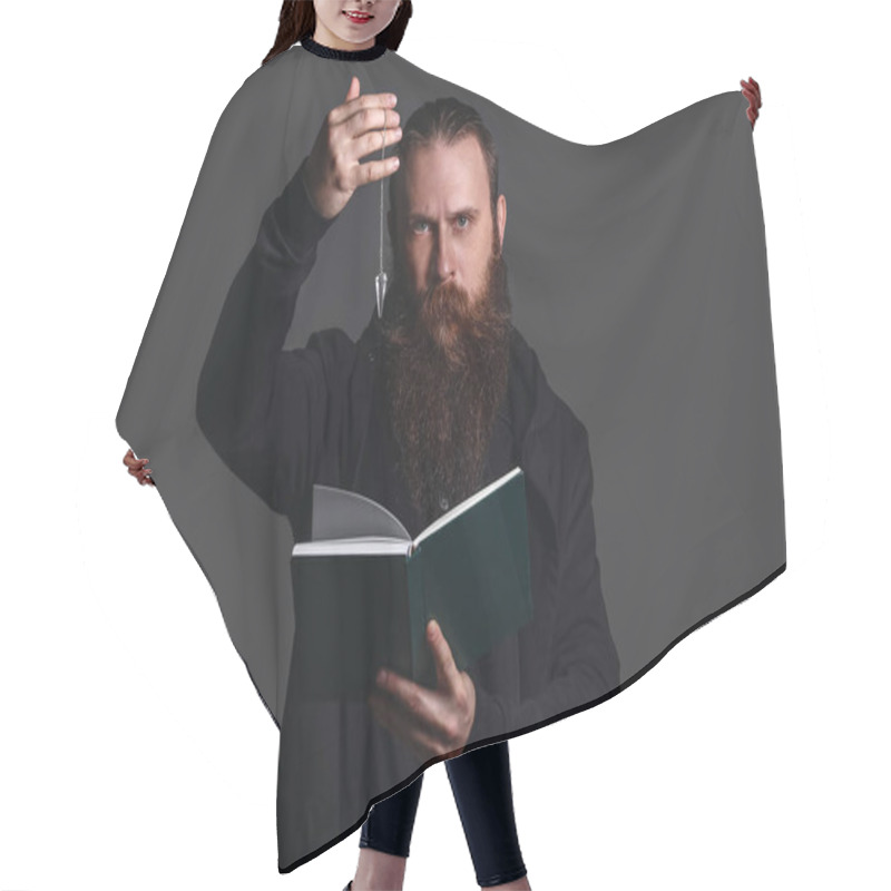 Personality  Male Fortune Teller With Book And Pendulum On Dark Background Hair Cutting Cape