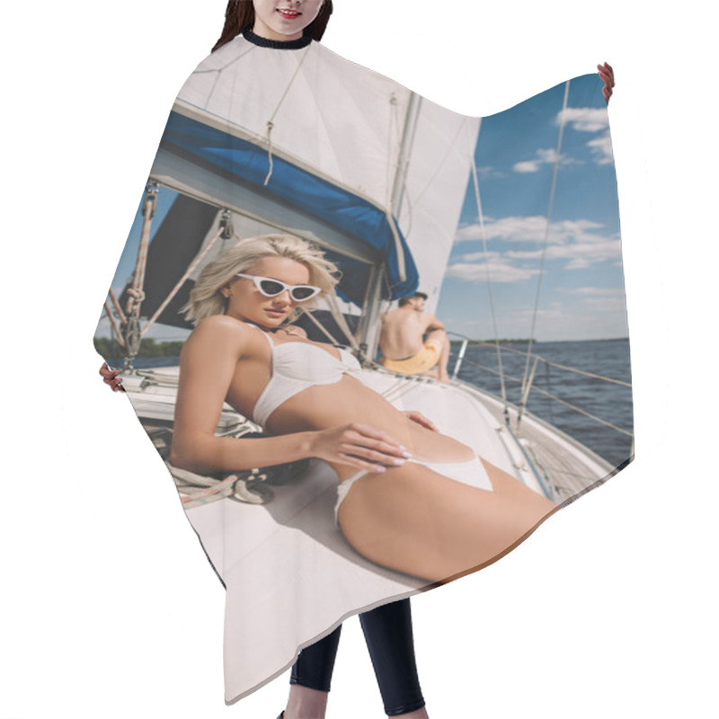 Personality  Attractive Young Woman In Bikini And Her Boyfriend Behind On Yacht  Hair Cutting Cape