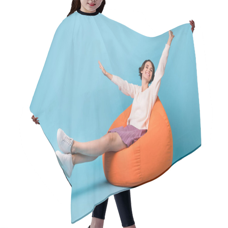 Personality  Photo Portrait Full Body View Of Girl Waking Up Stretching Sitting In Orange Beanbag Chair Isolated On Pastel Blue Colored Background Hair Cutting Cape