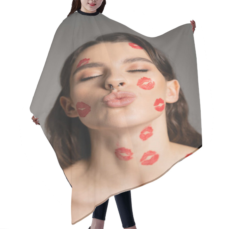 Personality  Portrait Of Sexy Woman With Closed Eyes And Red Kiss Prints On Face Pouting Lips Isolated On Grey Hair Cutting Cape