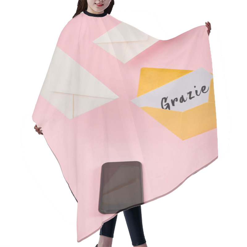 Personality  Yellow Envelope With White Card With Grazie Lettering Near Letters And Smartphone With Blank Screen On Pink Background Hair Cutting Cape