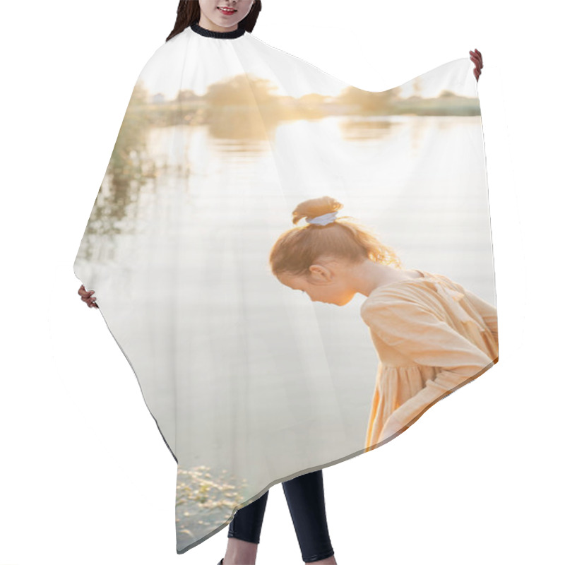 Personality  Curly Caucasian Girl Wearing Natural Linen Dress Standing Turned Back In Lake Water, Summertime. Coutryside Living. Summer Vibes. The Feeling Of Summer. Hair Cutting Cape