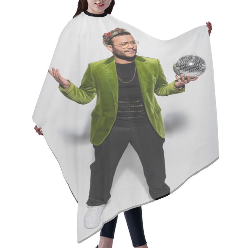 Personality  Confused Eastern Hip Hop Performer In Green Velvet Blazer And Crown Holding Disco Ball On Grey Hair Cutting Cape