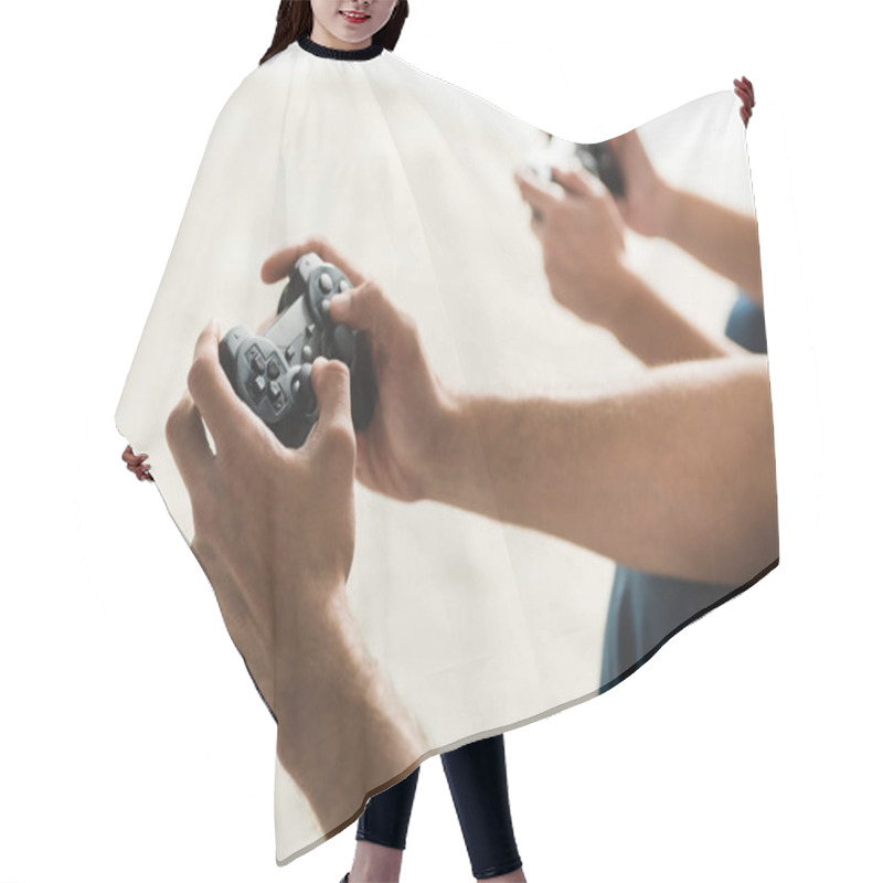 Personality  Cropped Shot Of Couple Playing Computer Games With Gamepads Hair Cutting Cape