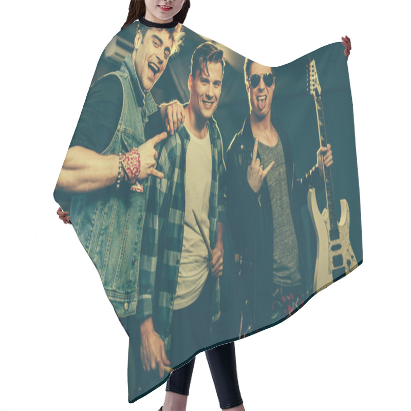 Personality  Handsome And Cheerful Rock Band Smiling While Showing Rock Signs  Hair Cutting Cape