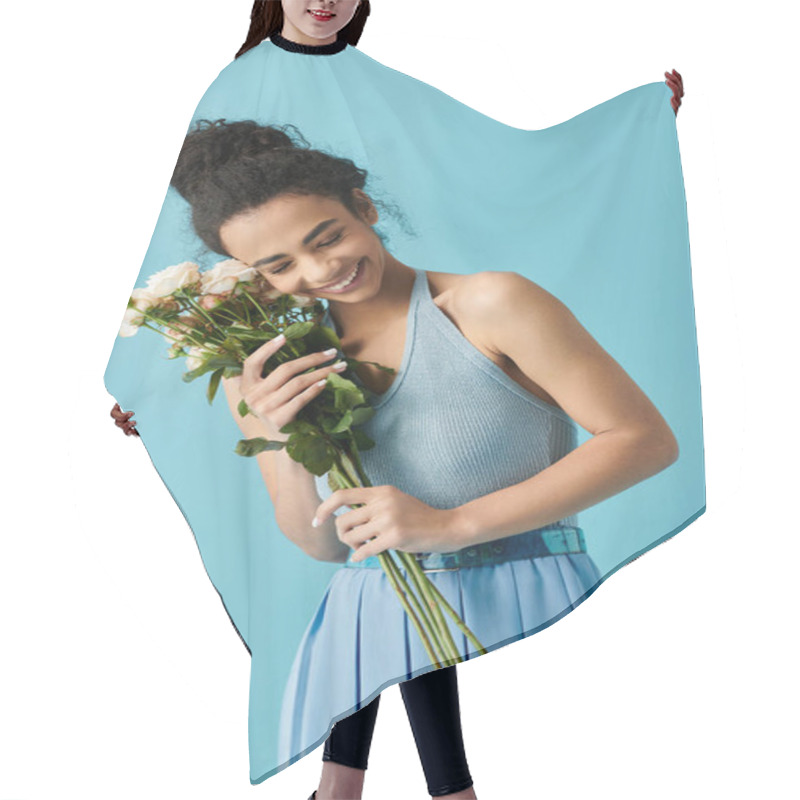 Personality  A Young Woman, Dressed In Blue, Smiles And Holds A Bouquet Of White Roses Against A Light Blue Background. Hair Cutting Cape