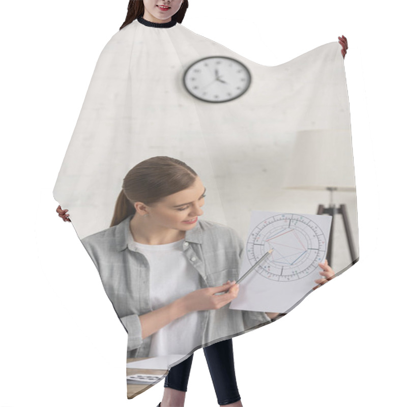 Personality  Smiling Astrologer Showing Natal Chart At Table With Laptop Hair Cutting Cape