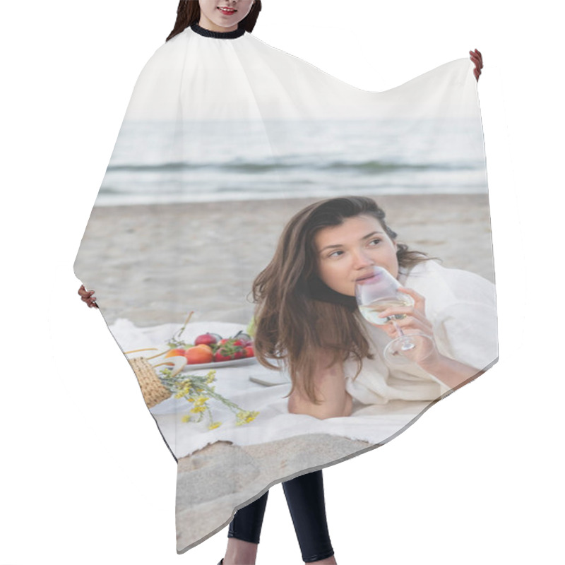 Personality  Young Woman Holding Wine Near Flowers In Handbag And Fruits On Blanket On Beach  Hair Cutting Cape