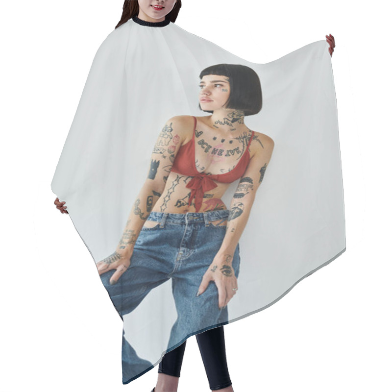 Personality  A Fashionable Woman Poses Confidently, Highlighting Her Vibrant Tattoos And Chic Attire. Hair Cutting Cape