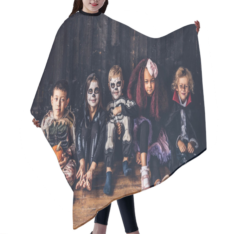 Personality  Halloween Party With Group Children Who Sitting Together On A Wooden Floor In An Old House. Halloween Concept. Hair Cutting Cape