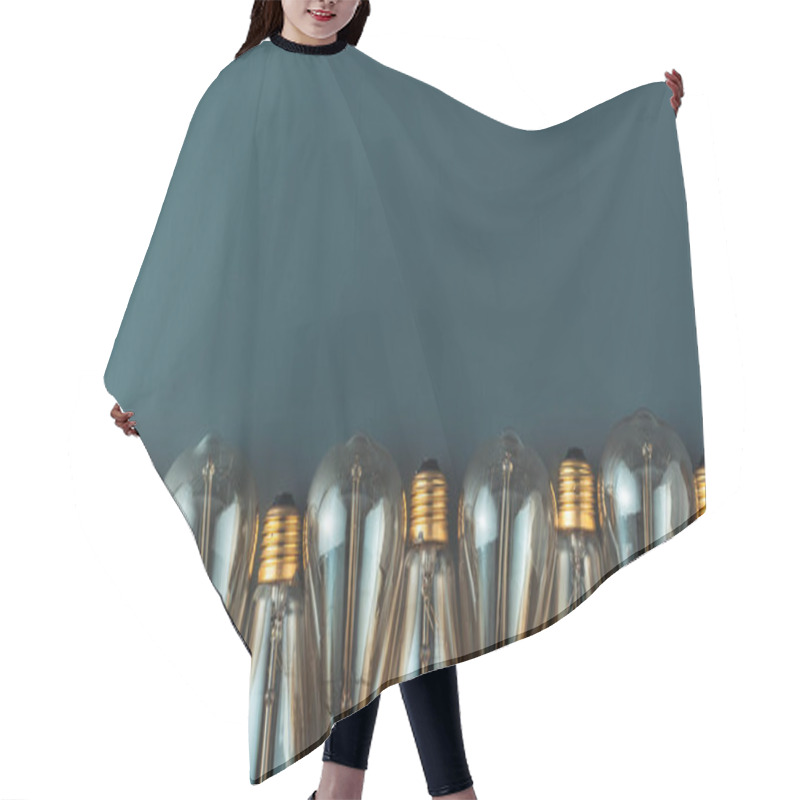 Personality  Close-up View Of Light Bulbs In Row On Grey Background Hair Cutting Cape