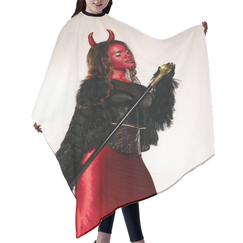 Personality  A Stunning Woman Adorned In A Fiery Devil Costume Captivates With Her Alluring Style. Hair Cutting Cape