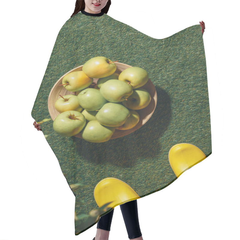 Personality  Cropped View Of Person In Yellow Rubber Boots Standing Near Wooden Bowl With Green Apples Hair Cutting Cape