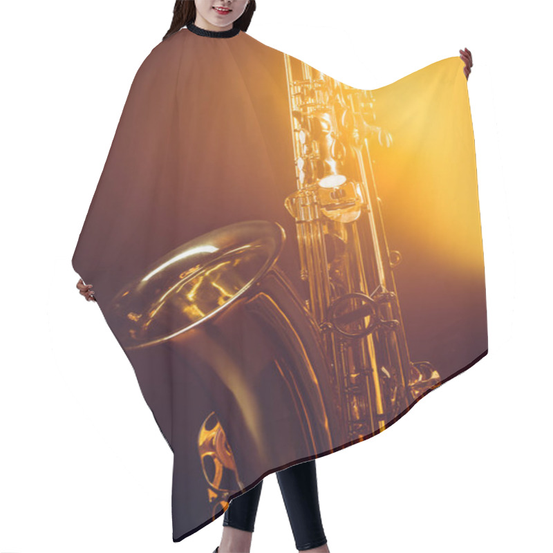 Personality  Close-up View Of Shiny Professional Saxophone And Spotlight On Black  Hair Cutting Cape