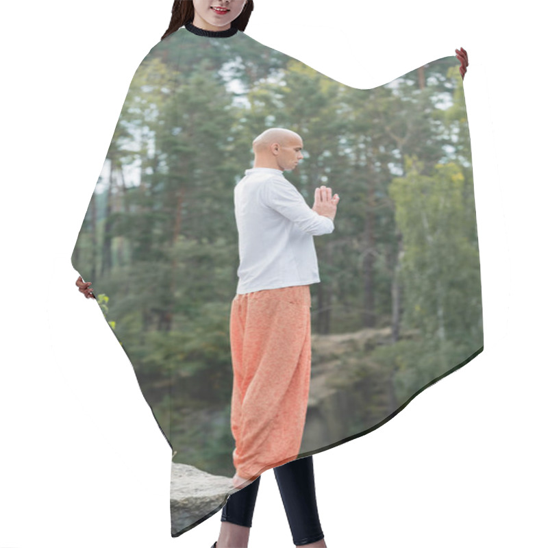 Personality  Full Length View Of Buddhist In Sweatshirt And Harem Pants Meditating With Praying Hands Outdoors Hair Cutting Cape