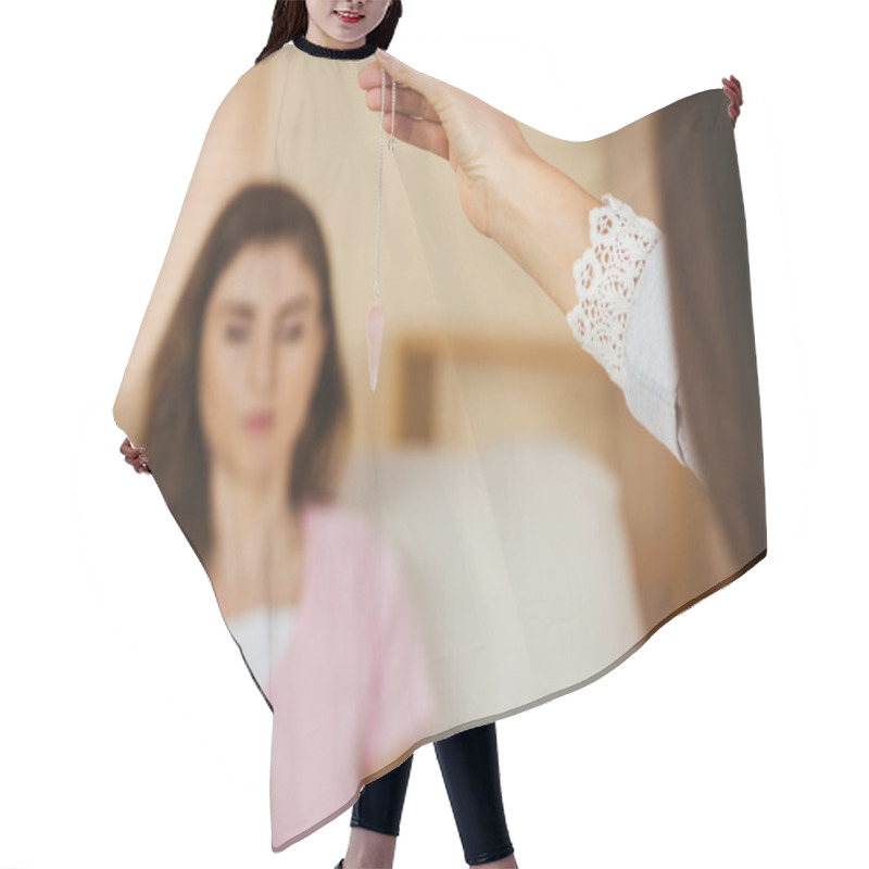 Personality  Hypnotherapist Holding Pendulum Before Hr Patient Hair Cutting Cape