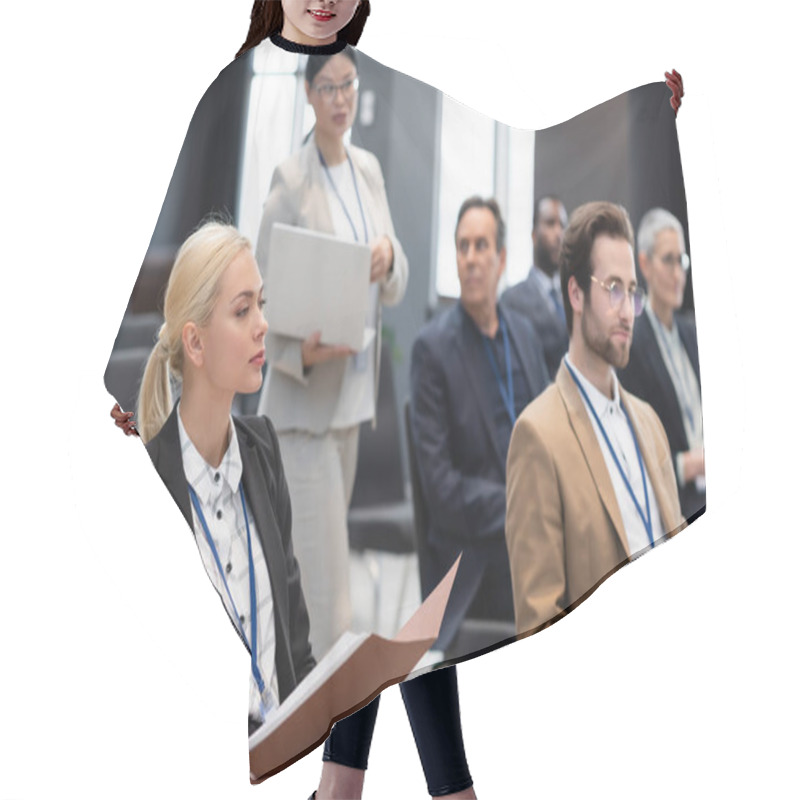 Personality  Businesswoman Holding Paper Folder Near Blurred Colleagues In Conference Room  Hair Cutting Cape