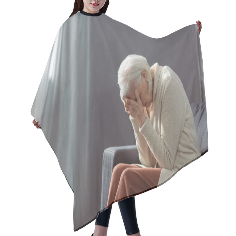 Personality  Depressed Senior Woman Sitting On Sofa With Bowed Had And Obscuring Face With Hands Hair Cutting Cape