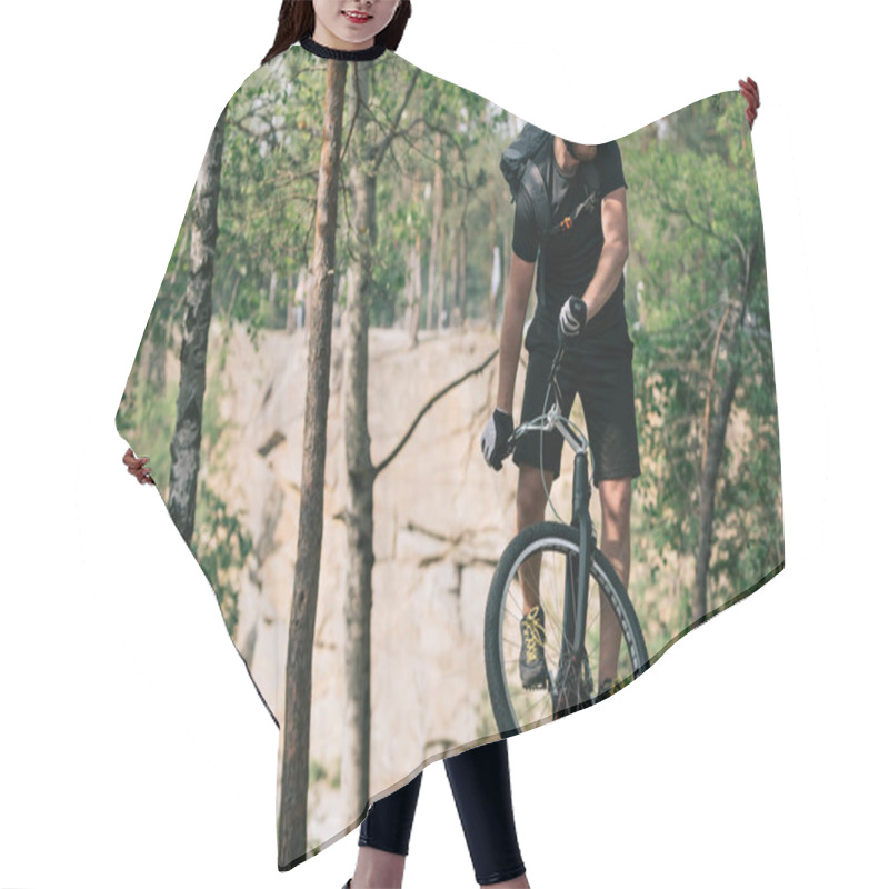 Personality  Young Male Extreme Cyclist In Protective Helmet Riding On Mountain Bicycle In Forest Hair Cutting Cape