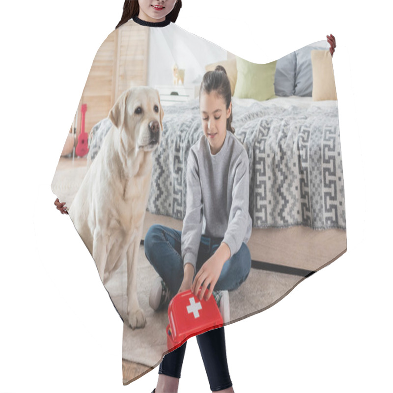 Personality  Smiling Girl Playing Doctor With Toy First Aid Kit And Labrador Dog On Floor In Bedroom Hair Cutting Cape