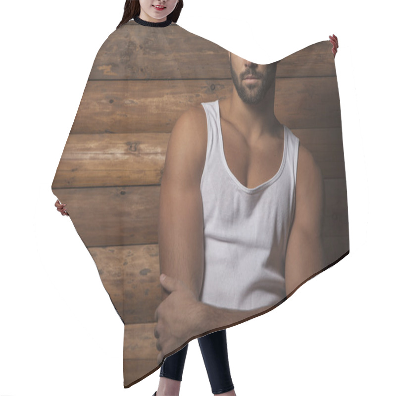 Personality  Portrait Of Young Beautiful Fashionable Man Against Wooden Wall. Hair Cutting Cape