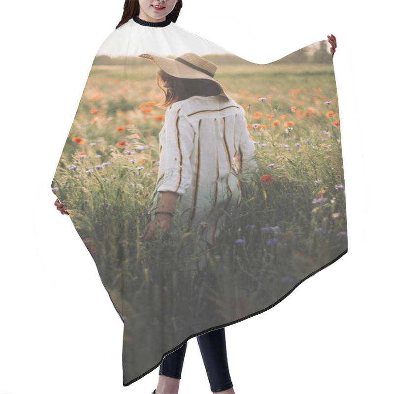 Personality  Stylish Girl In Hat Walking In Wildflowers In Sunset Light In Summer Meadow. Young Woman In Linen Dress Walking Among Poppy And Cornflowers In Countryside. Rural Slow Life. Enjoying Simple Life Hair Cutting Cape