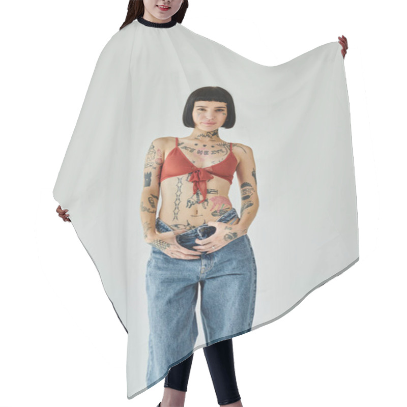 Personality  A Stylish Young Woman With Tattoos Strikes A Pose, Expressing Her Individuality. Hair Cutting Cape