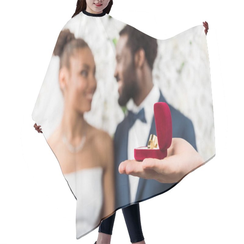 Personality  Selective Focus Of Man Holding Box With Wedding Ring Near African American Couple  Hair Cutting Cape