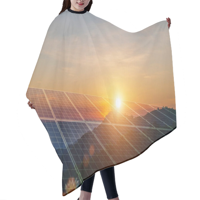 Personality  Environmental Sustainable Energy Concept. Solar Panels Clean Energy Generating Electricity. Photovoltaic Cells On The Sunset. Hair Cutting Cape