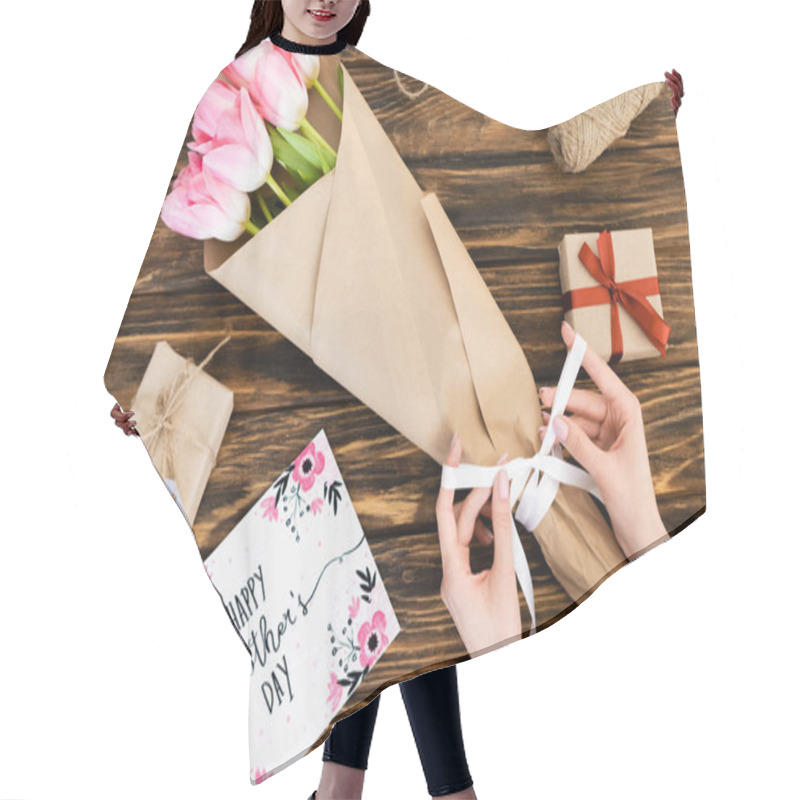 Personality  Cropped View Of Woman Touching Ribbon On Wrapped In Paper Pink Tulips Near Greeting Card With Happy Mothers Day Lettering And Gift Boxes On Wooden Surface   Hair Cutting Cape