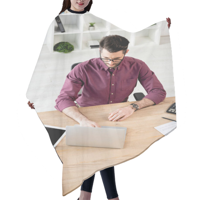 Personality  High Angle View Of Serious Businessman Using Laptop Near Digital Tablet With Blank Screen And Documents Hair Cutting Cape