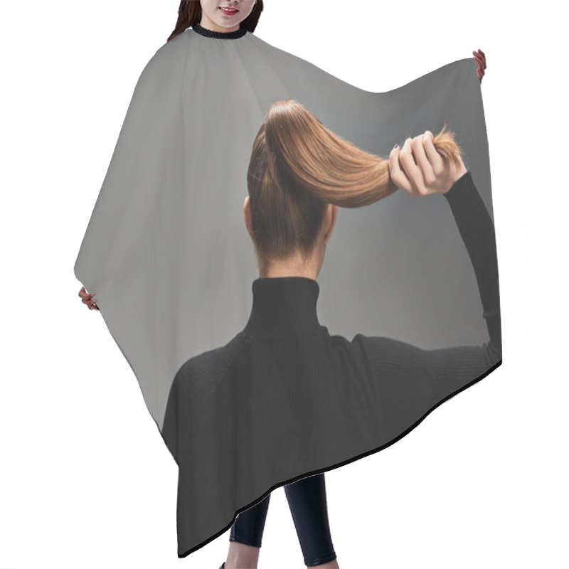 Personality  Back View Of Young Stylish Woman With Long Hair Elegantly Styled In A Ponytail, Exuding Grace And Confidence. Hair Cutting Cape