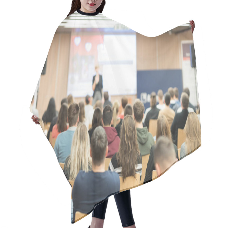 Personality  Female Speaker Giving Presentation On Business Conference. Hair Cutting Cape