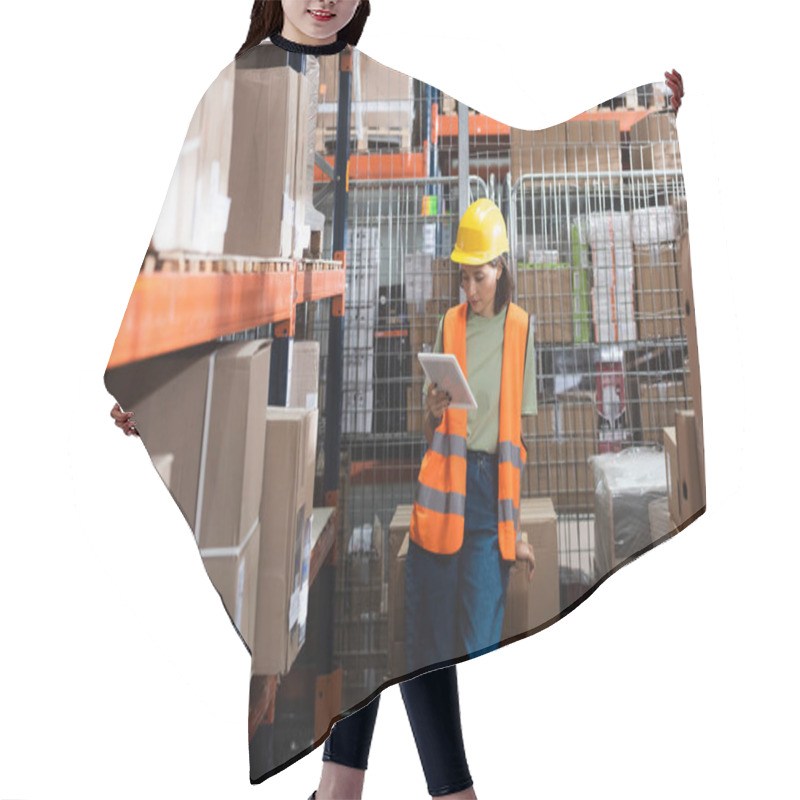 Personality  Female Warehouse Worker In Safety Vest And Hard Hat Holding Digital Tablet Near Cargo Boxes Hair Cutting Cape