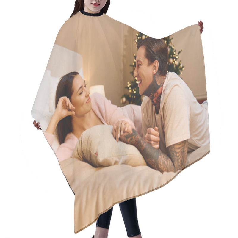 Personality  A Loving Couple Laughs And Looks Into Each Others Eyes While Relaxing On Their Bed. Hair Cutting Cape