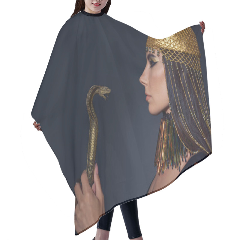 Personality  Side View Of Woman In Egyptian Attire Holding Crook In Snake Shape On Blue Background Hair Cutting Cape