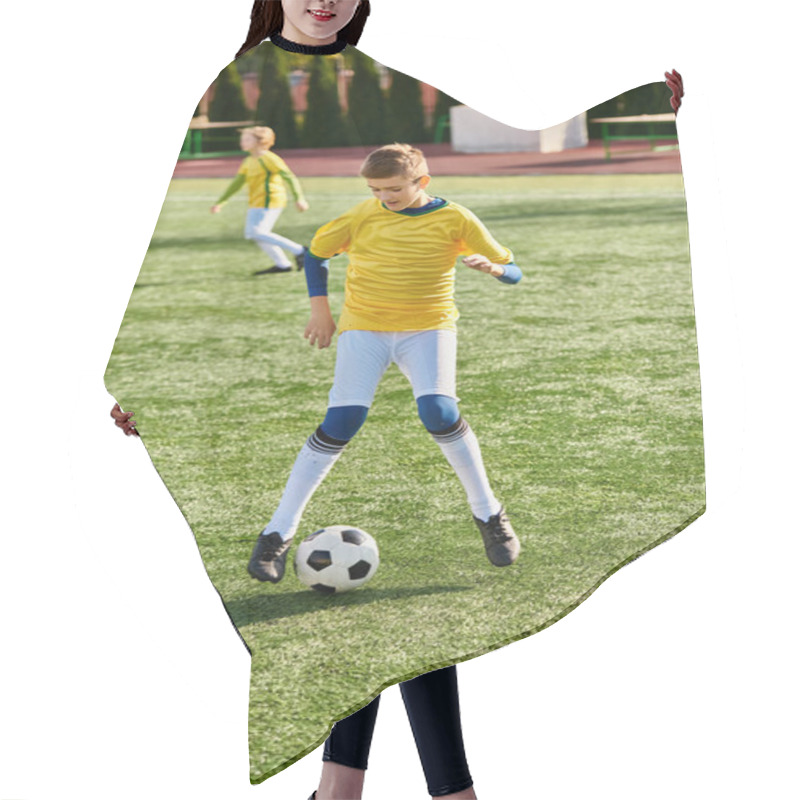 Personality  A Young Man Energetically Kicks A Soccer Ball On A Vast Green Field, Showcasing His Skills And Passion For The Sport. Hair Cutting Cape