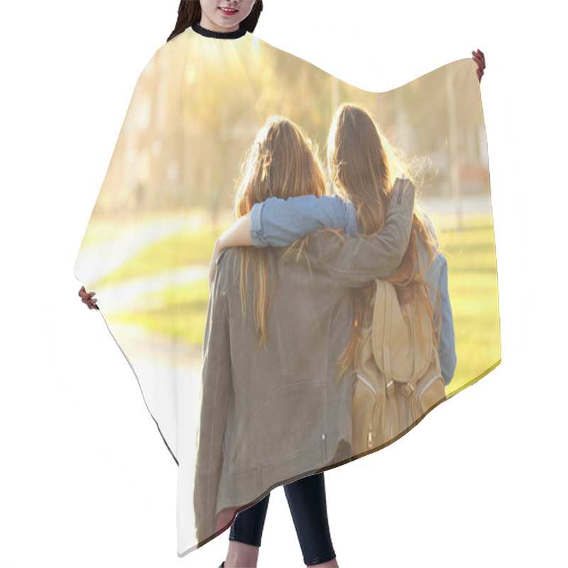 Personality  Back View Portrait Of Two Affectionate Friends Walking At Sunset In A Park Hair Cutting Cape