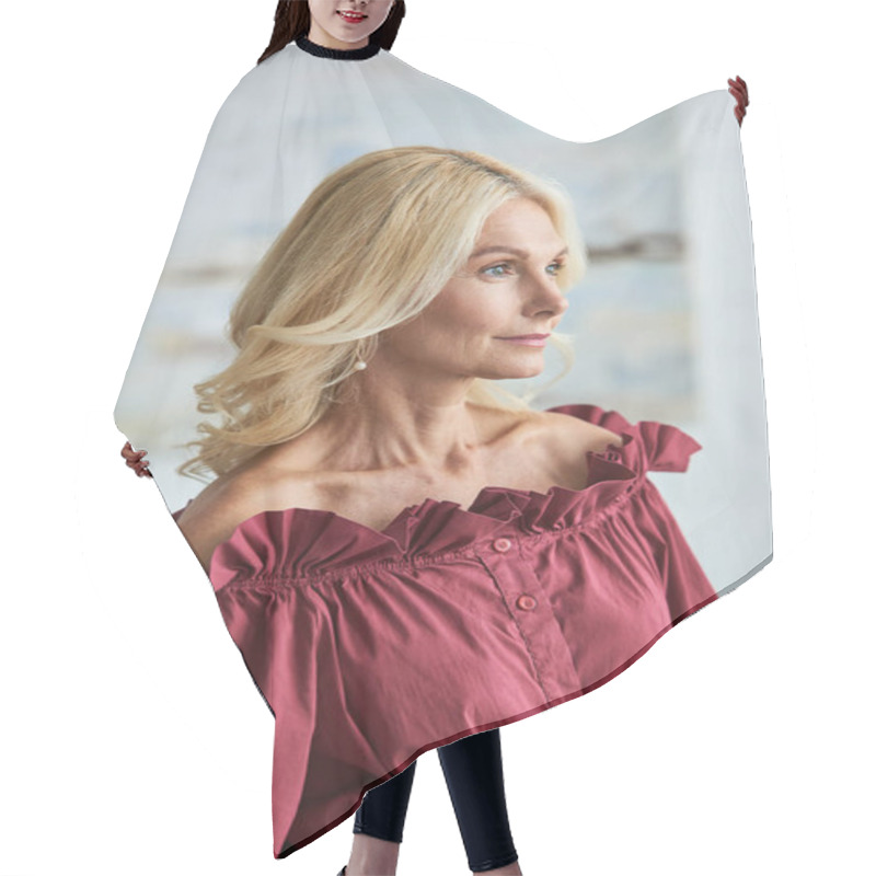 Personality  A Mature Woman With Blonde Hair In A Stylish Red Blouse. Hair Cutting Cape