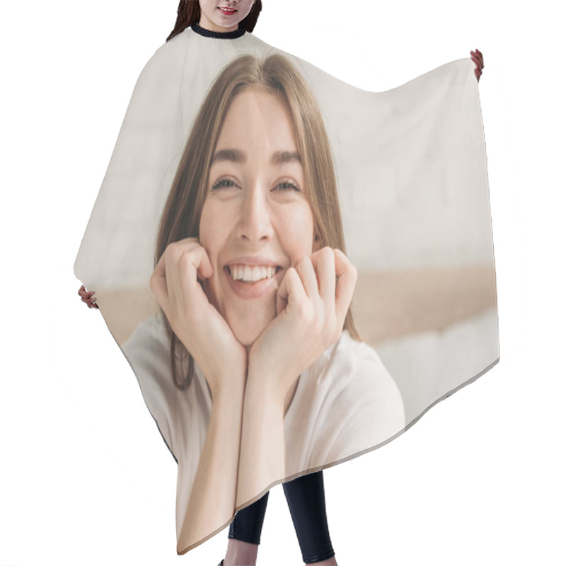 Personality  Cheerful Young Woman Laughing At Camera While Holding Hands Near Face Hair Cutting Cape