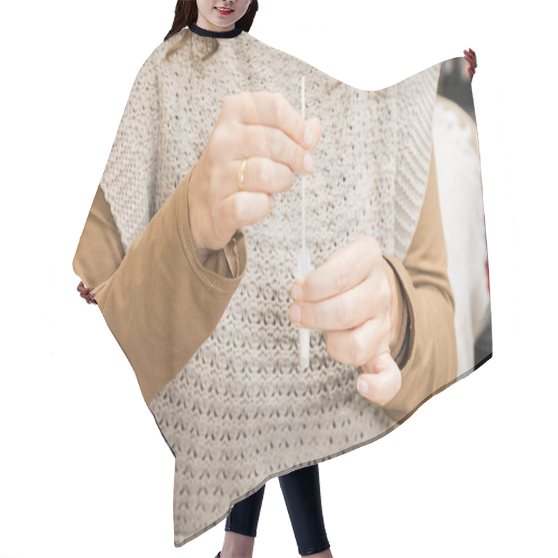 Personality  Detail Of A Woman's Hands Preparing A Sample For A Covid19 Antigen Self-test In Her Living Room. Hair Cutting Cape