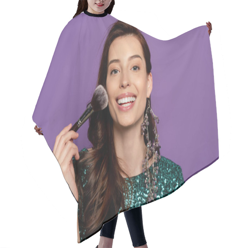 Personality  Cheerful Woman Holding Cosmetic Brush While Applying Blush Isolated On Purple Hair Cutting Cape