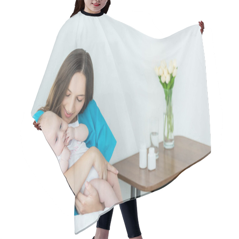 Personality  Attractive And Young Mother Holding Her Child In Hospital  Hair Cutting Cape